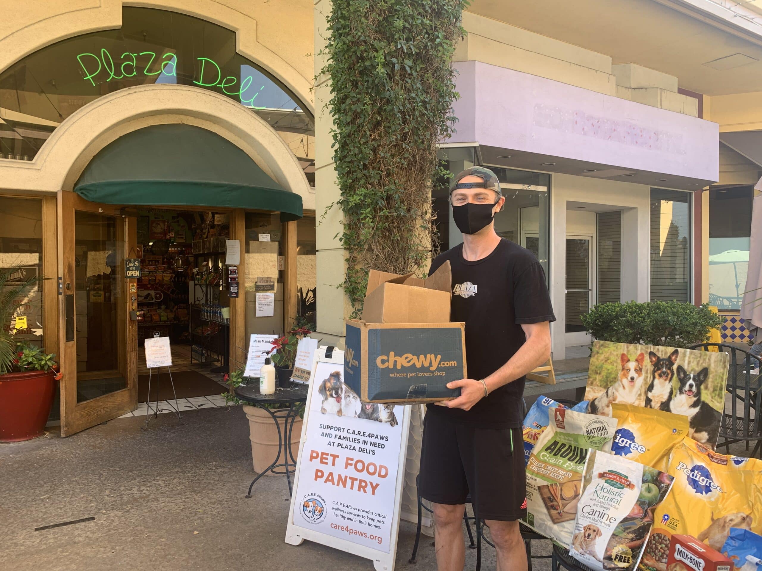 C.A.R.E.4Paws Donation Drive in Santa Barbara at Plaza Deli employees with pet food donations