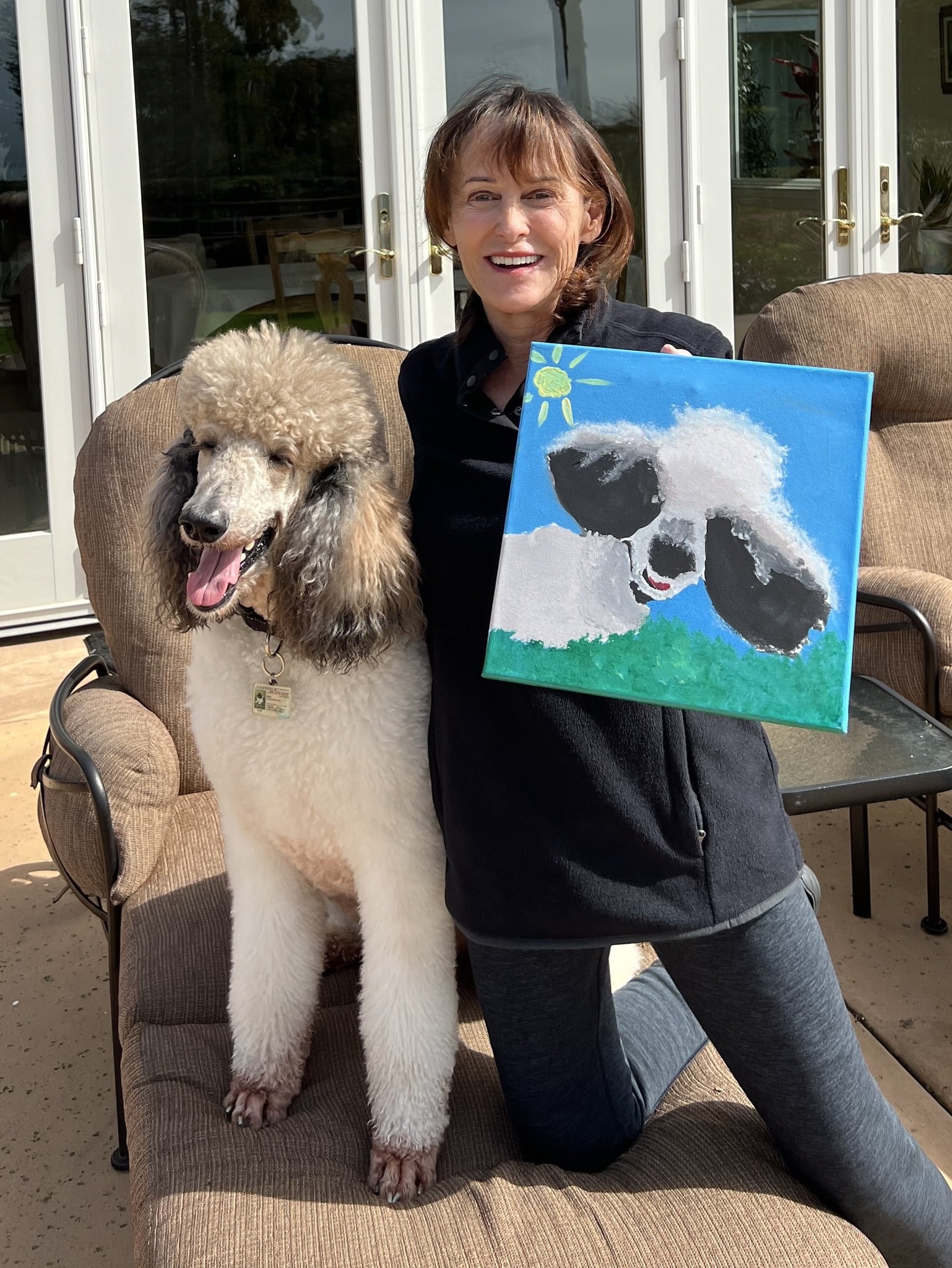 Donor with her pet portrait of her dog