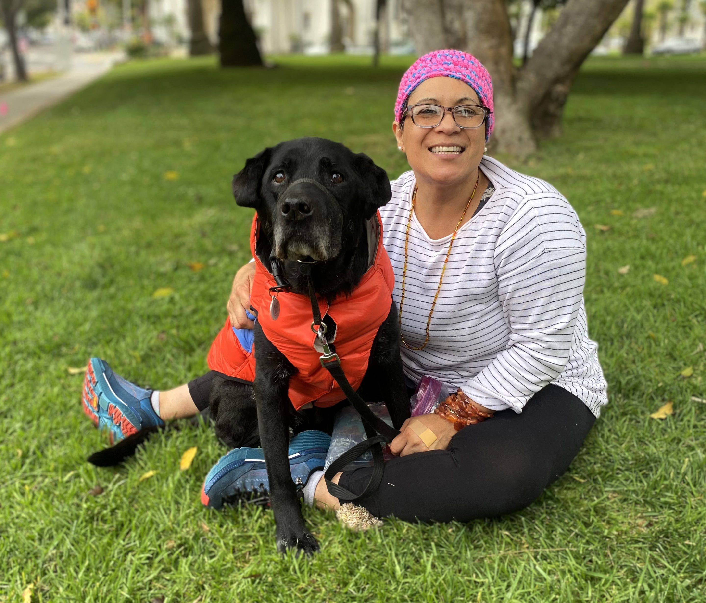 Pet family Lucia and Luckie sitting in the park