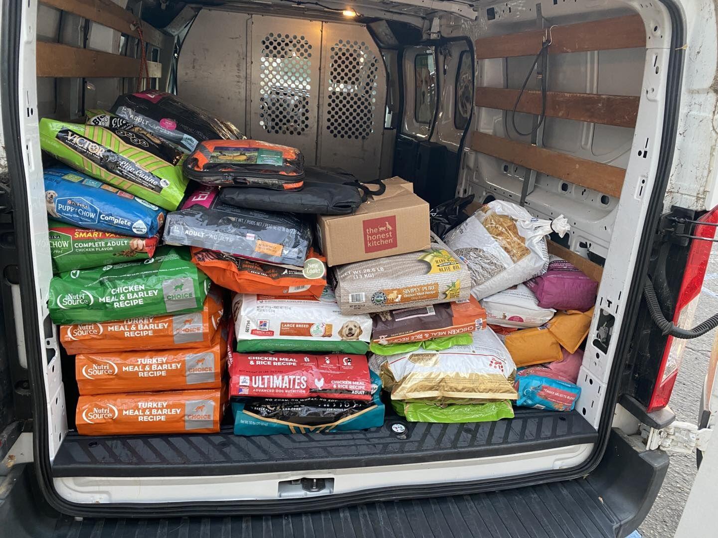 Cargo van filled with pet supplies and food