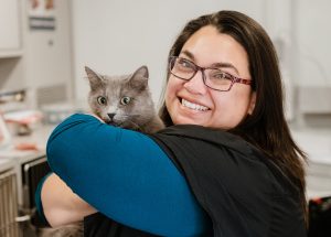Vet tech with grey cat