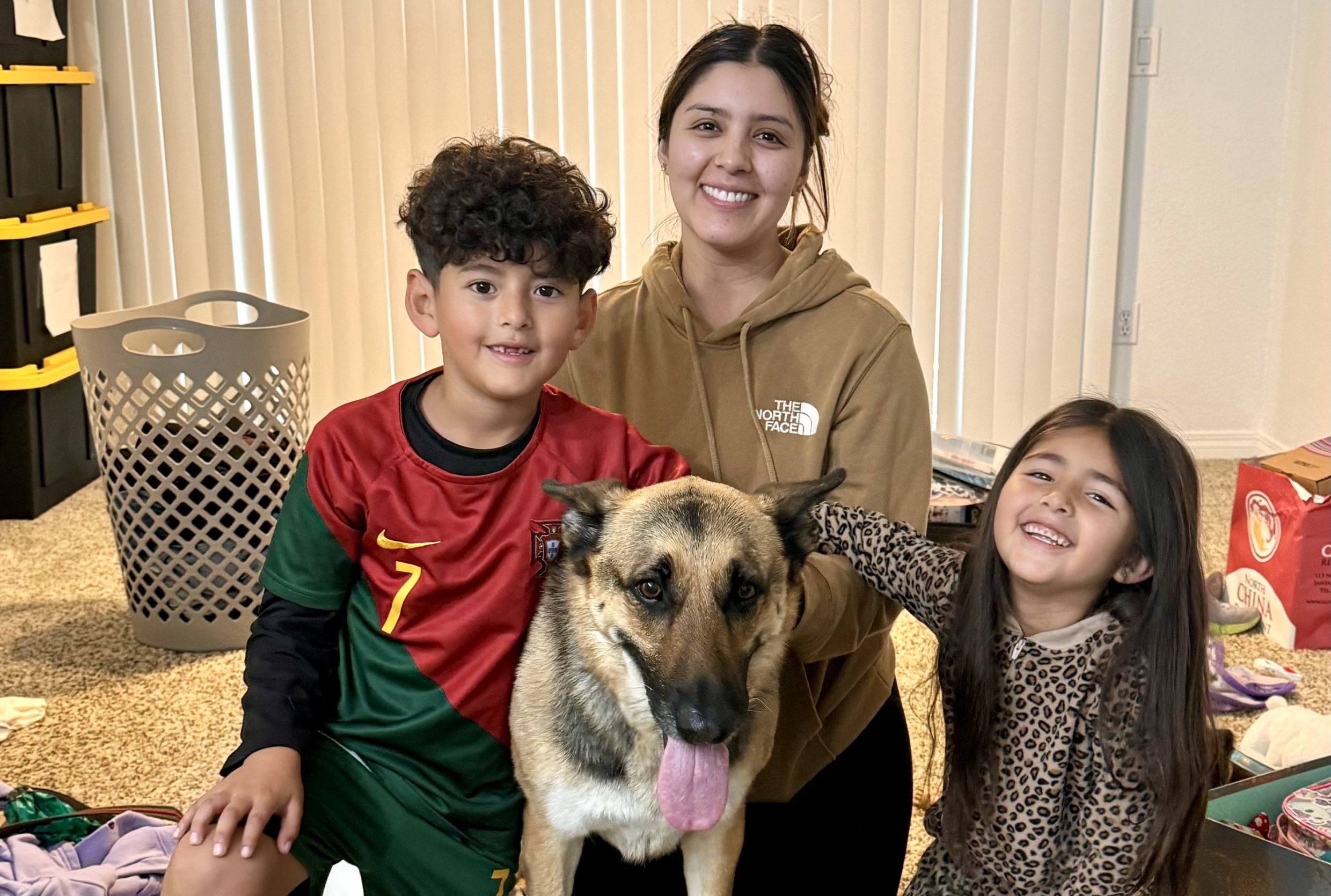 Pet family being reunited with their dog after a life transition