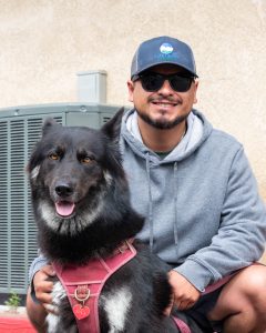 Man with large black dog