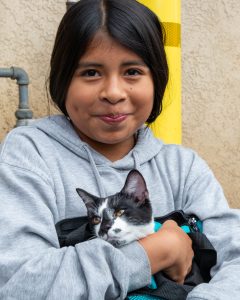Pet Wellness Clinic in Oceano with PetSmart Charities shows a girl holding her cat closely in a carrier