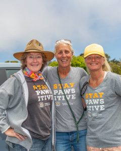Three volunteer at the riverbed