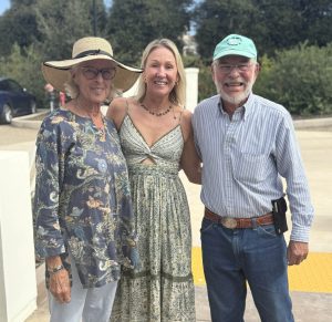 Executive Director, Isabelle Gullo posing with two attendees