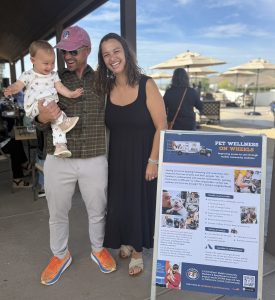 Our lead veterinarian with her husband and child at Paws & Pours