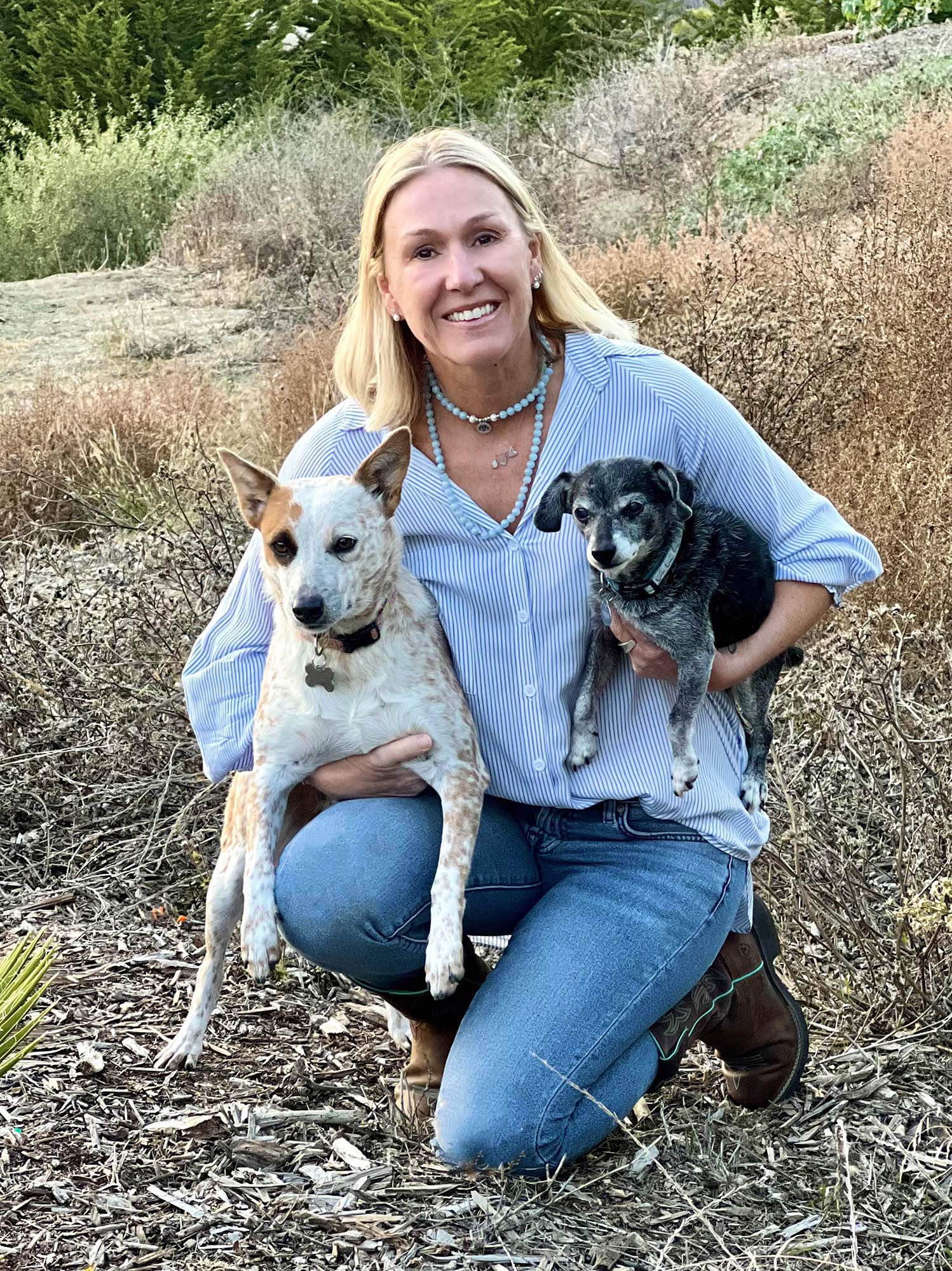 Isabelle Gullo with C.A.R.E.4Paws and two of her dogs